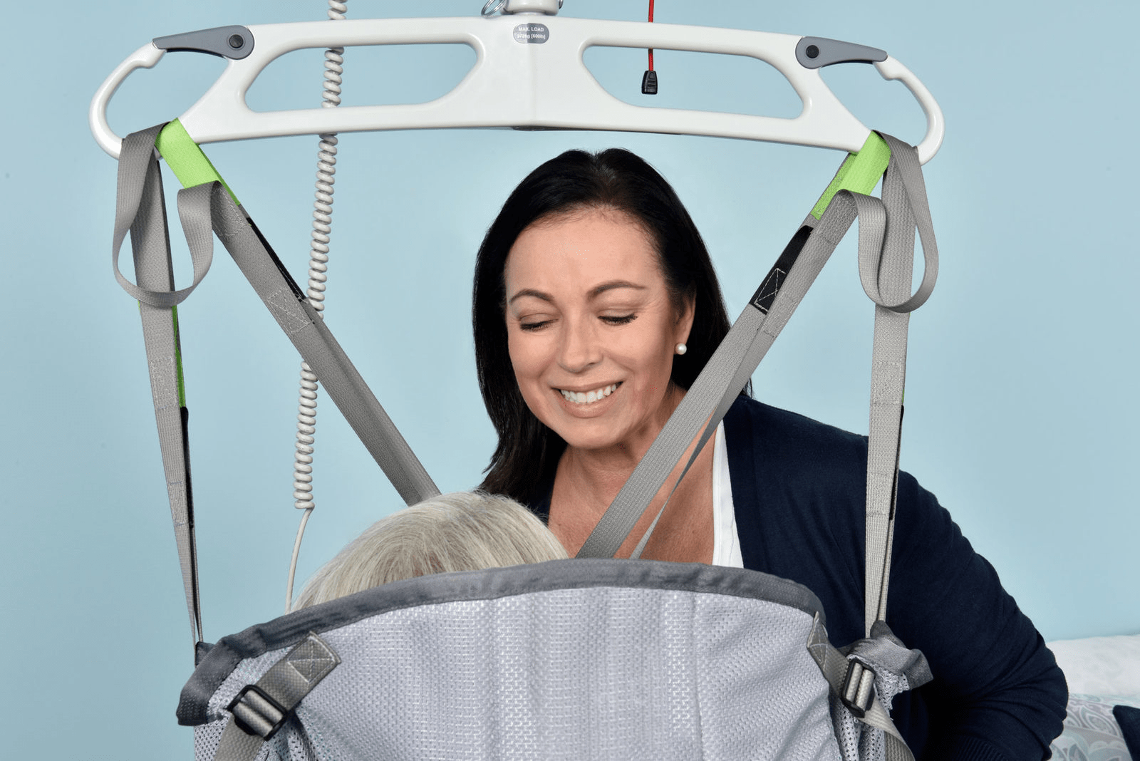 Woman using a ceiling hoist